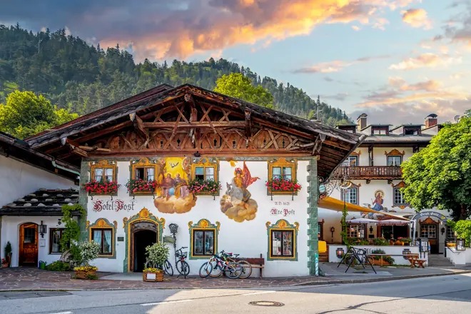 A Bavarian inn with a painted facade and flower boxes, illustrating the guide to the ten-year rule for Americans moving to Germany